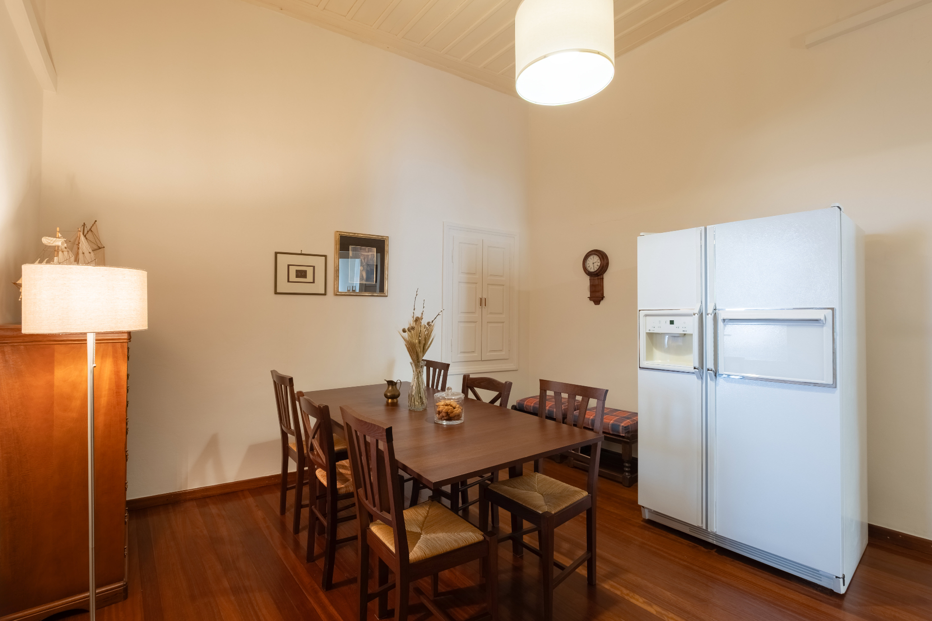 Dining area with wooden table and traditional interior details.